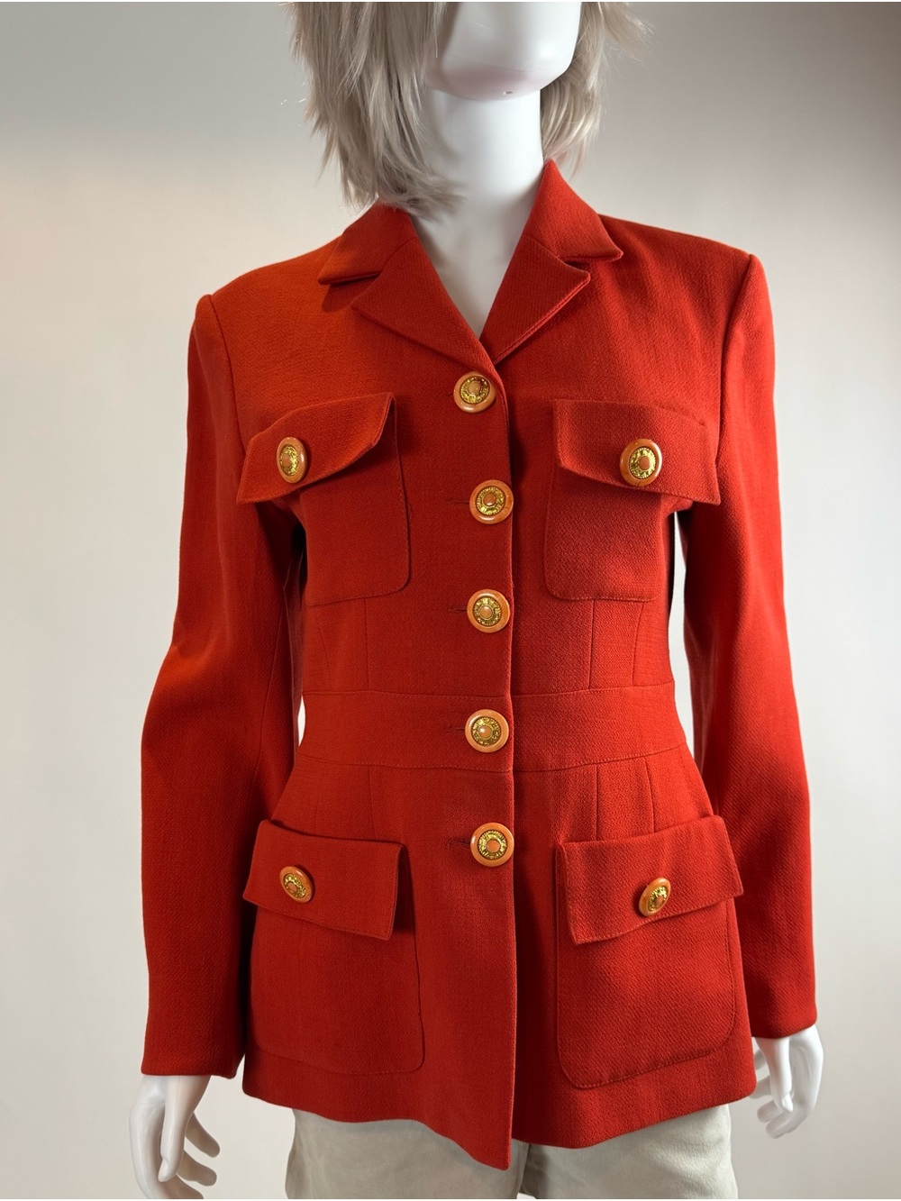 Woman’s vintage orange Evelyne Mandel Paris jacket.